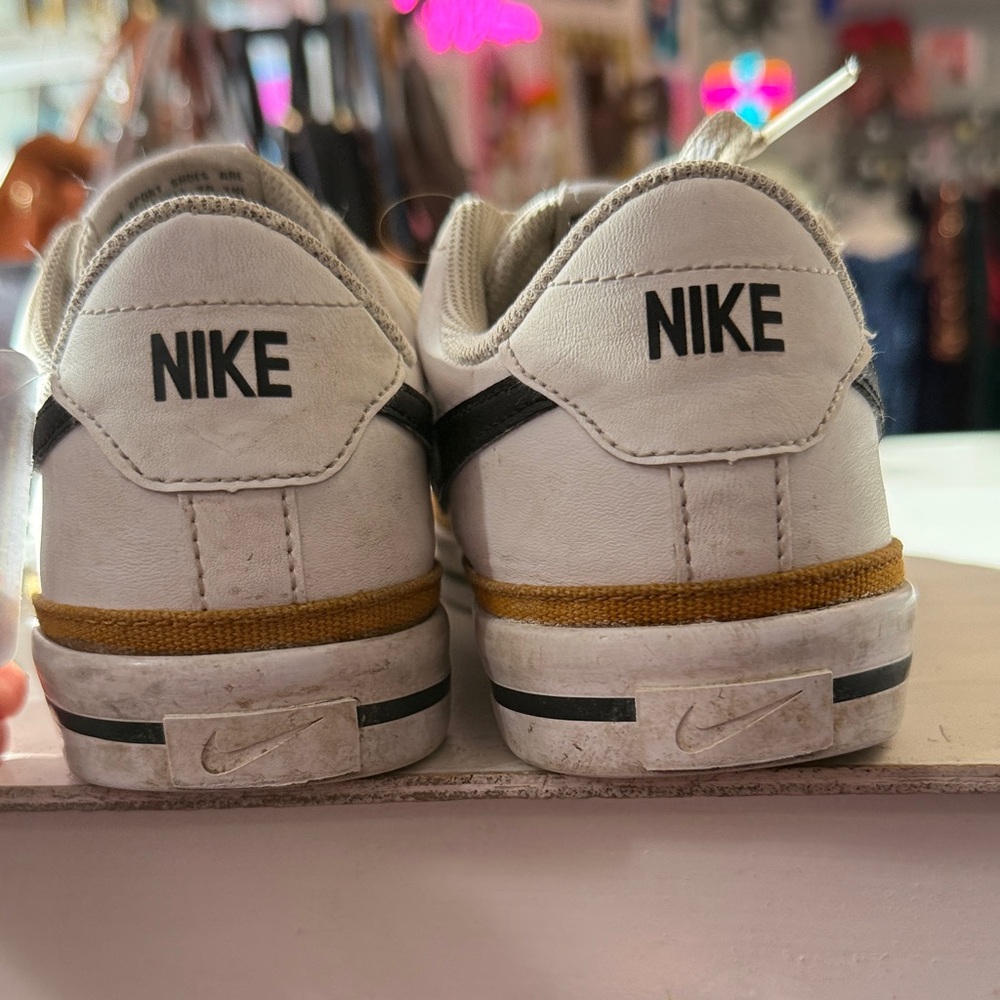 Nike White Sneakers with Black Swoosh and Gold Stripe - Picture 4 of 5
